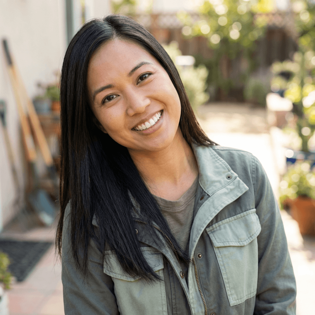 Female homeowner in her early 30s, Asian, relaxed and satisfied expression